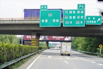 Xian, Shaanxi, China, Asia, View of a motorway with direction signs and passing vehicles, Asia