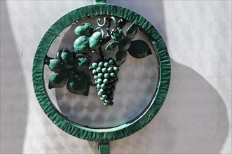 Eguisheim, Alsace, France, Europe, Green metal decoration with a grape motif, Europe