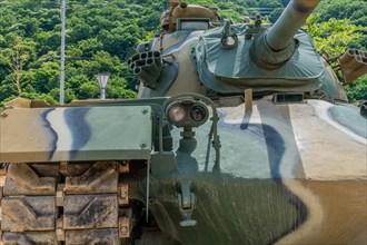 Front view of camouflaged tank used in Korean war on display in public park in Nonsan, South Korea,