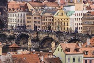 Figures of saints, crowds of people, Charles Bridge, stone bridge, view of Prague Castle, Prague