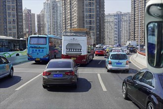 Traffic in Shanghai, Shanghai Shi, People's Republic of China, Dense traffic with buses and cars in