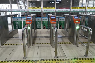 Hongqiao railway station, Shanghai, China, Asia, Access area with turnstiles and ticket readers in