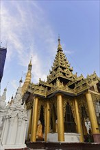 Shwedagon Pagoda, Yangon, Myanmar, Asia, Golden temple with complex decorations under a blue sky
