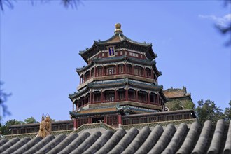 New Summer Palace, Beijing, China, Asia, A tall traditional Chinese tower rises above the trees