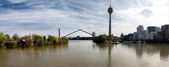 View from the harbour bridge at the media harbour to Rheinkniebruecke, Rheinturm and