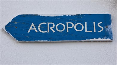 Old, blue signpost with the word 'ACROPOLIS' in white colour, Lindos, Rhodes, Dodecanese, Greek