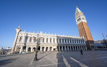 Campanile bell tower in Piazetta San Marco, Colonna di San Todaro, St Mark's Square, Venice,