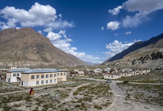 View of houses still inhabited in the ghost town of Engilchek, mountain landscape, Tian Shan,