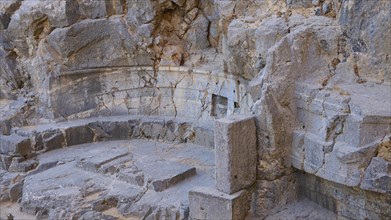 At the entrance to the Acropolis, detailed view of the ruins of an ancient stone structure at an