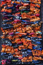 Colourful stacked migrant lifejackets exhibition called Soleil Levant by Chinese artist Ai Weiwei,