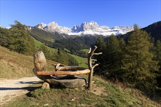 Mountain view from a rustic wooden bench on a sunny autumn day, Italy, TAlto Adige, Bolzano