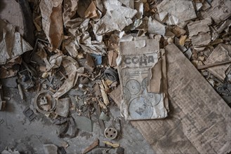 Old newspaper and objects from the USSR, Abandoned ruins, ghost town Enilchek in the Tien Shan