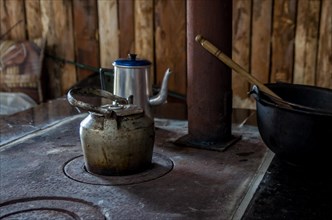 Beautiful steel kettle on wood stove in the countryside, Cambara do sul, Rio Grande do sul, Brazil,