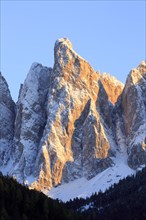 Dramatic view of a snow-covered mountain face during a sunrise, Italy, Trentino-Alto Adige, Alto