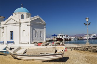 Beached fishing boats and traditional Greek Orthodox church, Old harbour, Mykonos Town, Mykonos