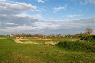 Landscape near Pogum, left pumping station, right houses in the village, municipality Jemgum,