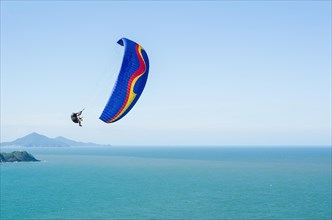 Camboriu, Brazil, December 10, 2017: Students practicing paragliding on the hill, South America