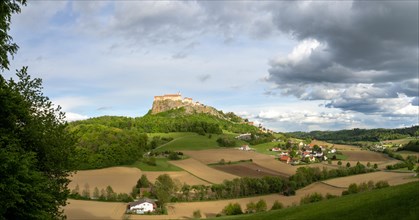 Riegersburg in the evening light, foreground field, panoramic view, cloudy mood, Riegersburg,