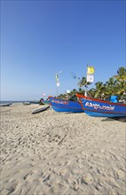 Colourful fishing boats on Marari Beach, Mararikulam, Alappuzha district, Kerala, India, Asia