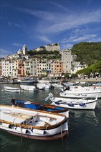 Harbour with fishing boats and colourful apartment building facades at Portovenere, La Spezia