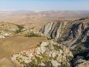 Moldo-Ashuu Pass, mountain landscape with steep rocks between yellow hills, near Baetov, Naryn