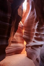 Sunshine breaks through the surface and bathes the crevice in a glowing light, Upper Antelope