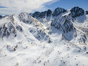 Extensive snow-covered mountain landscape with striking peaks, landscape near El Pas de la Casa,