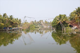 Chinese fishing nets on the AS Canal from Alappuzha to Vembanad Lake, Kerala, India, Asia