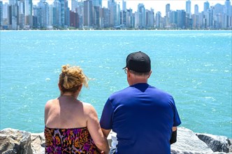 Old couple looking at the horizon, beach, love