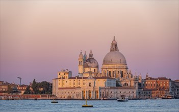 Church Basilica di Santa Maria della Salute at sunrise, view over the water, Venice, Veneto, Italy,