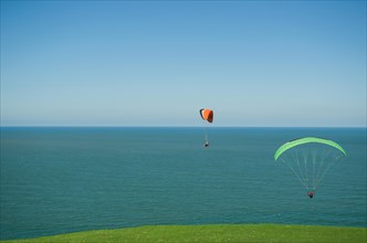 Camboriu, Brazil, December 10, 2017: Students practicing paragliding on the hill, South America