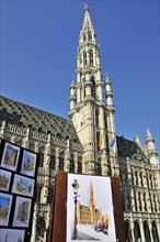Painting, behind it the town hall with Gothic tower, Grand Place, Brussels, Belgium, Benelux,