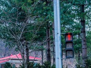 Pedestrian crossing lights in urban neighborhood with no walking red light illuminated in South