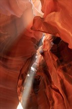 Sunlight falls through narrow crevices of Antelope Canyon and creates a luminous spectacle, Upper