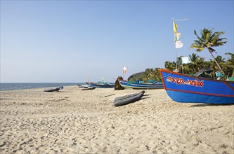 Colourful fishing boats on Marari Beach, Mararikulam, Alappuzha district, Kerala, India, Asia