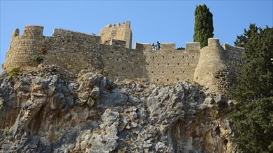 St John's Fortress, Mighty medieval fortress walls perched on a rocky hill under a clear sky,