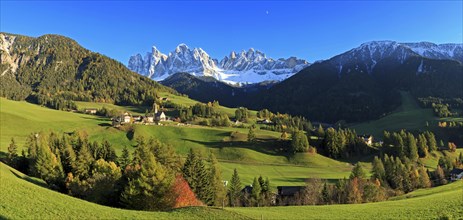 Wide panorama of an alpine landscape with meadows and scattered houses, Italy, Trentino-Alto Adige,