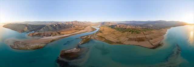 Panorama, River mouth of the Naryn River at Toktogul Reservoir at sunset, aerial view, Kyrgyzstan,