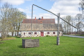 Older well with a lever-type pump in Sankt Olof, Simrishamn municipality, Scania, Sweden,