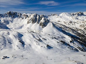 View of ski slopes in an alpine resort with snow-covered slopes, Grau Roig, Encamp, Andorra,