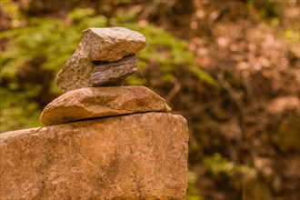 Pyramid of three stones balanced on top of one another used to make wish for better future in South