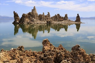 Peaceful scene with limestone rocks reflected in the clear water surface, Mono Lake, North America,