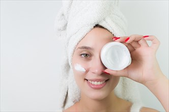 Skincare, product and woman with cream on face, and excited advertising luxury skin care promotion.