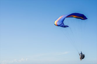 Camboriu, Brazil, December 10, 2017: Students practicing paragliding on the hill, South America