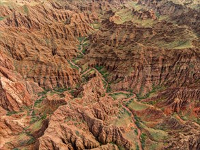 Badlands, river in a gorge with eroded red sandstone rocks, Konorchek Canyon, Boom Gorge, aerial