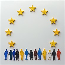 Paper figures in different colours represent the diversity of Europe, surrounded by EU stars, AI