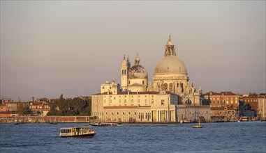Church Basilica di Santa Maria della Salute at sunrise, view over the water, Venice, Veneto, Italy,