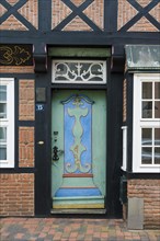 Half-timbered house and old wooden door in the old town centre, Buxtehude, Altes Land, Lower