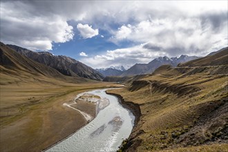 Mountain valley with Sary Jaz river, autumn mountains with yellow grass, Tien Shan, Kyrgyzstan,