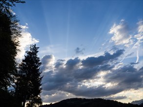 Sunbeams breaking through a cloud, Leoben, Styria, Austria, Europe